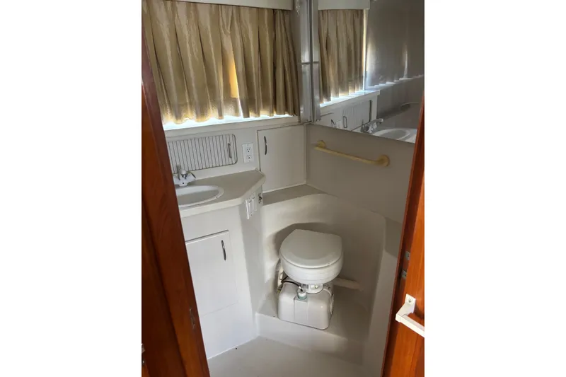Slide: The Image of Bathroom interior of 1995 Carver 356 Aft Cabin Motor Yacht with sink and toilet. - 24