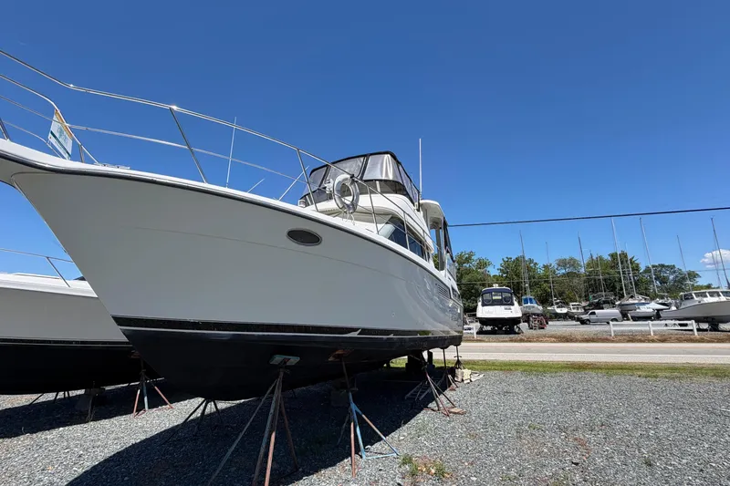 Slide: The Image of 1995 Carver 356 Aft Cabin Motor Yacht on stands, clear blue sky background. - 5