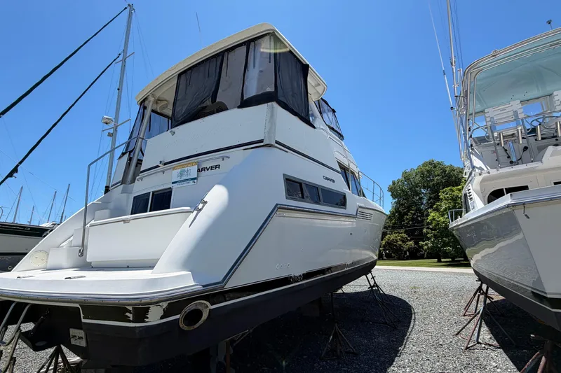 Slide: The Image of 1995 Carver 356 Aft Cabin Motor Yacht on display, surrounded by other boats. - 8