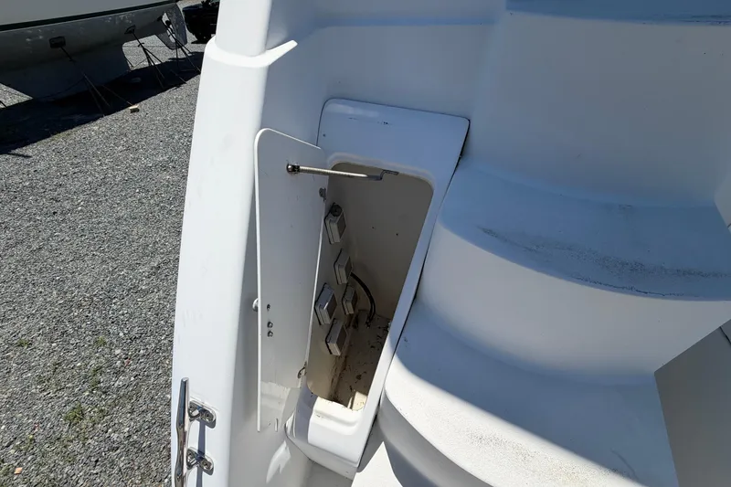 Slide: The Image of 1995 Carver 356 Aft Cabin Motor Yacht showing open storage compartment near steps. - 9