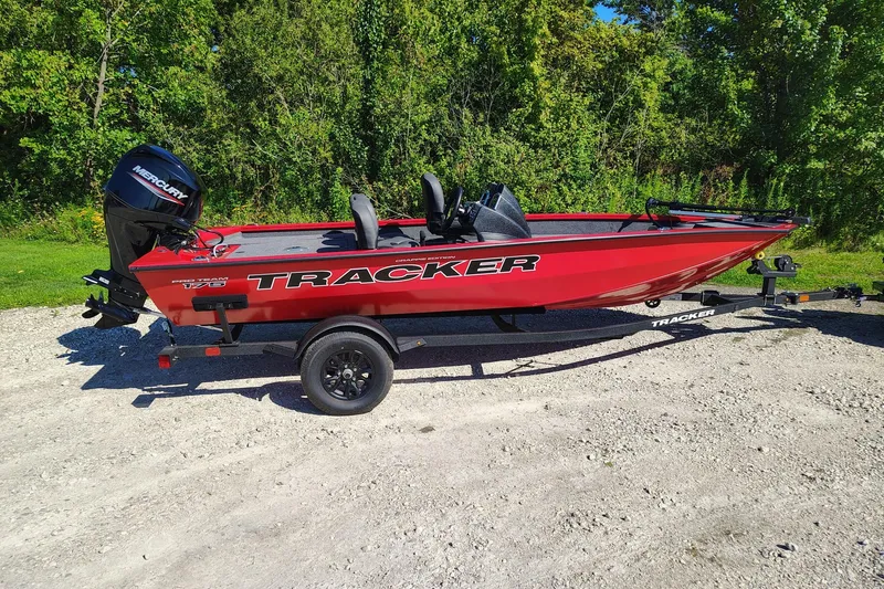 The Image of 2026 Tracker Pro Team 175 Crappie Edition boat on trailer, parked outdoors. - 0