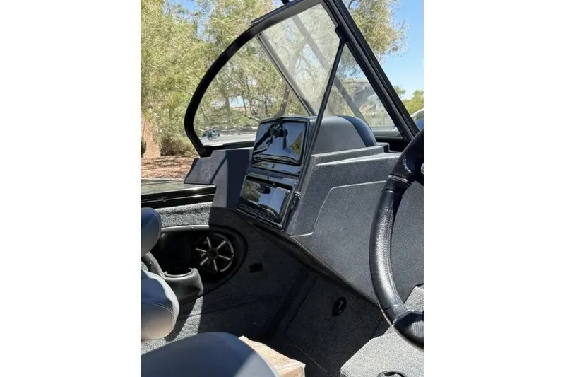 Slide: The Image of 2026 Tracker Targa V-19 Combo boat interior with steering wheel and dashboard. - 9