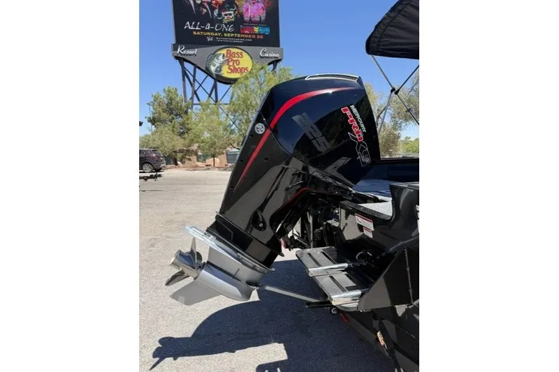 Slide: The Image of 2026 Tracker Targa V-19 Combo boat with powerful outboard motor in sunny outdoor setting. - 6