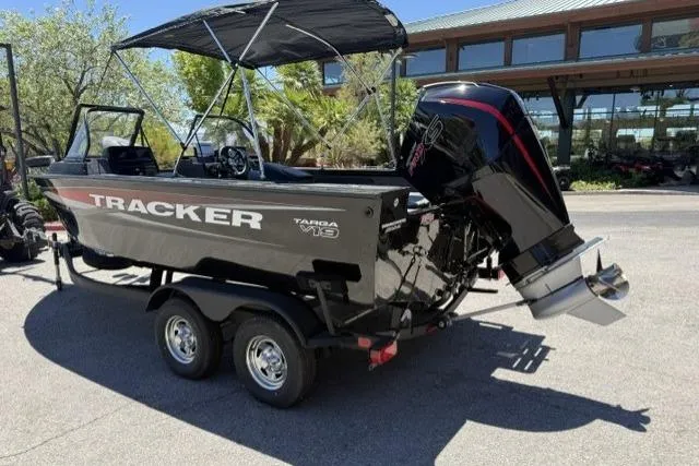 Slide: The Image of 2026 Tracker Targa V-19 Combo boat on trailer, parked outdoors. - 3