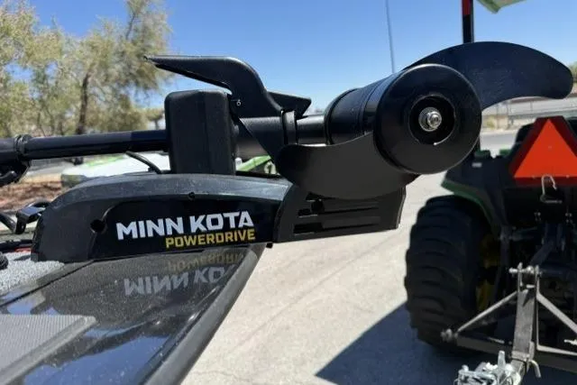 Slide: The Image of Minn Kota PowerDrive motor on 2026 Tracker Targa V-19 Combo boat, outdoor setting. - 7