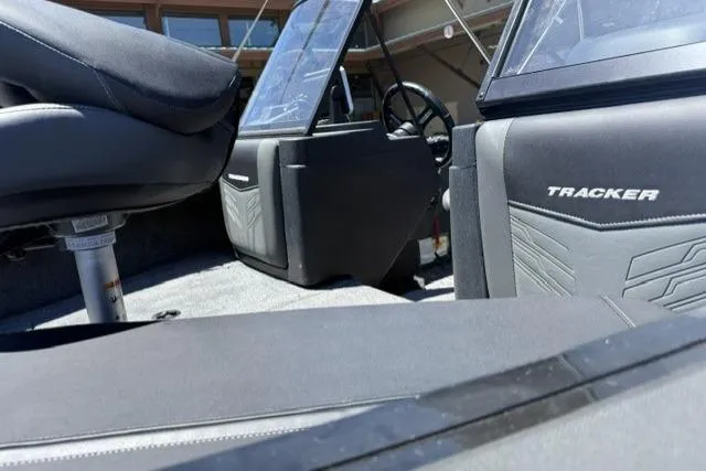 Slide: The Image of Interior of 2026 Tracker Targa V-19 Combo boat with seating and steering wheel. - 11