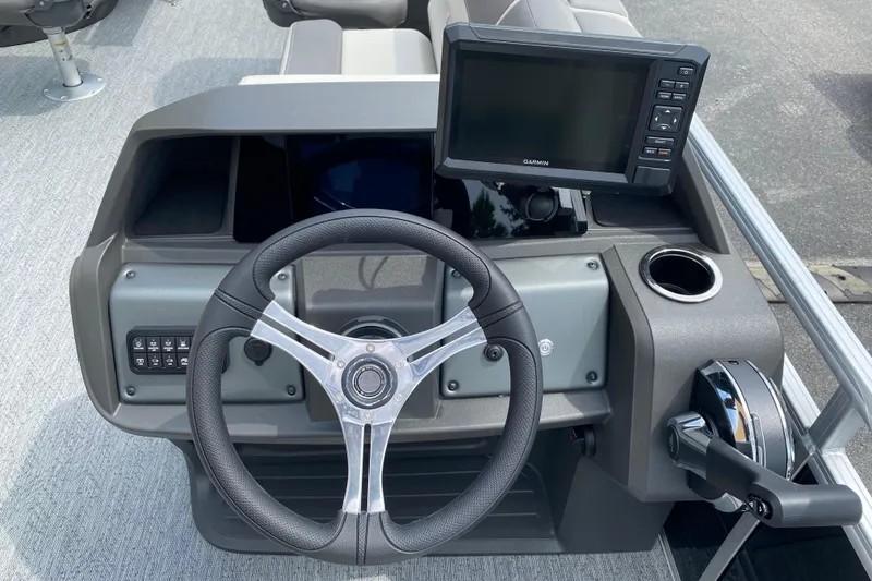 Slide: The Image of Steering console of 2026 Sun Tracker Fishin' Barge 20 DLX with Garmin display. - 4