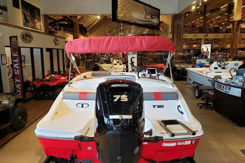 Slide: The Image of 2026 Tahoe T16 boat with Mercury 75 engine displayed in showroom. - 3