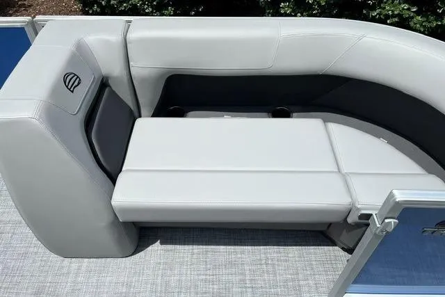Slide: The Image of 2026 Sun Tracker Party Barge 18 DLX pontoon boat seating area with gray upholstery. - 12