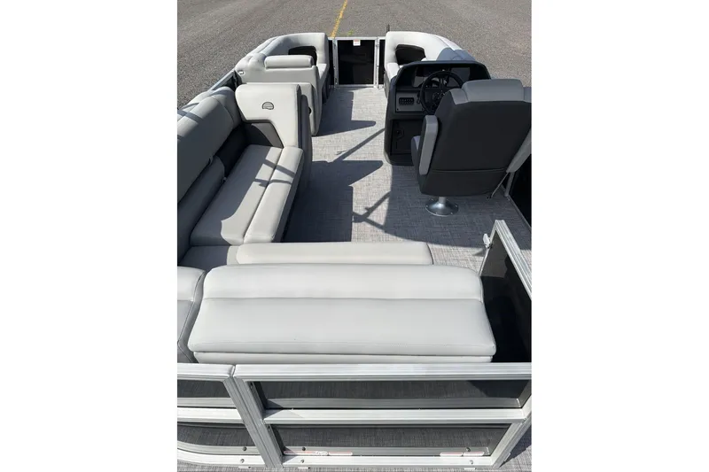 Slide: The Image of 2026 Sun Tracker Party Barge 20 DLX interior with spacious seating and modern helm. - 9