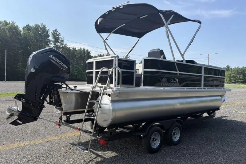 Slide: The Image of 2026 Sun Tracker Party Barge 20 DLX pontoon boat with canopy and outboard motor. - 5