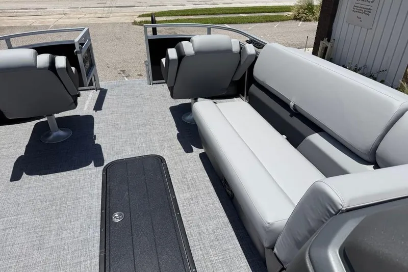 Slide: The Image of 2026 Sun Tracker Sportfish 24 XP3 interior with gray seating and spacious layout. - 1