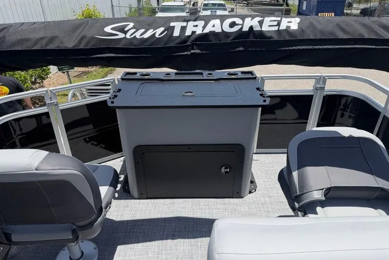 Slide: The Image of 2026 Sun Tracker Sportfish 24 XP3 pontoon boat interior with seating and storage. - 6