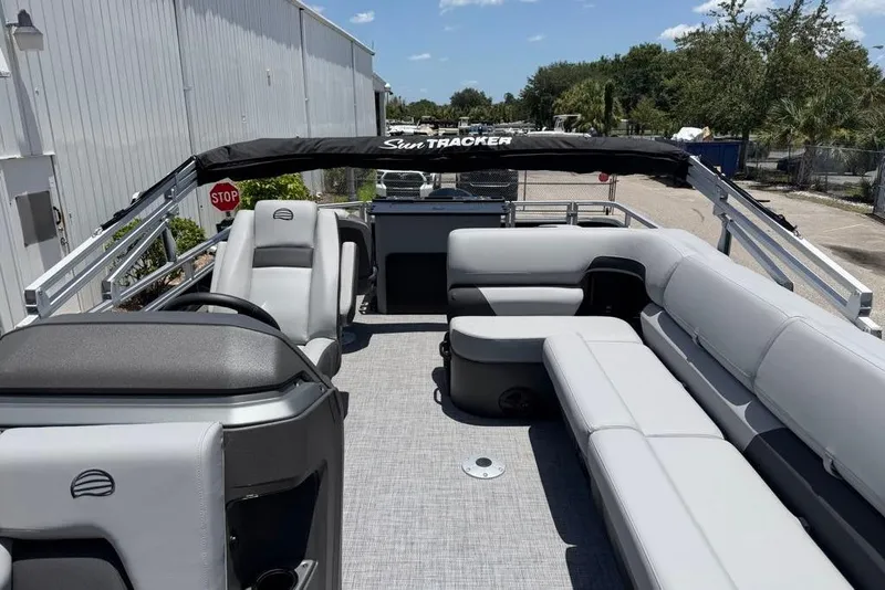 Slide: The Image of 2026 Sun Tracker Sportfish 24 XP3 pontoon boat with spacious seating and sleek design. - 4