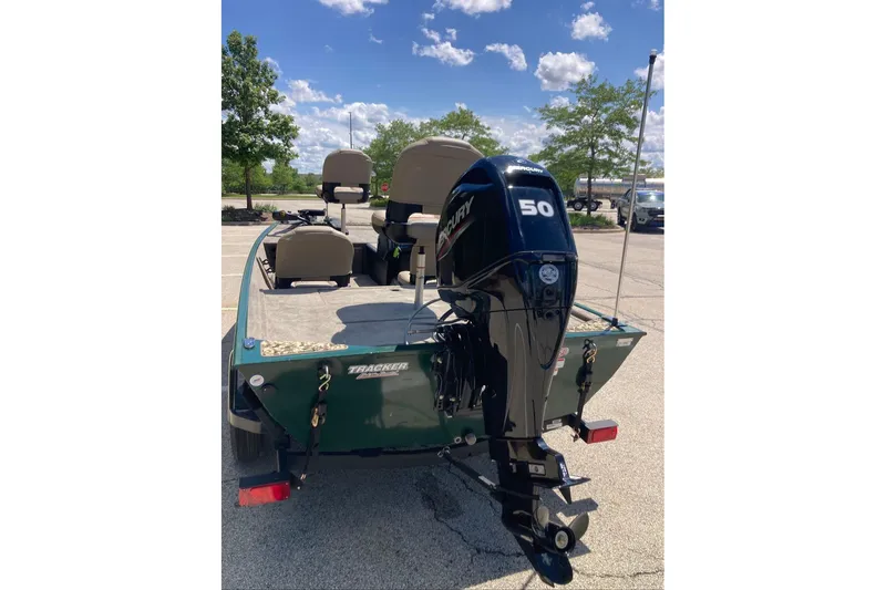 Slide: The Image of 2026 Tracker Bass Tracker Classic Limited boat with Mercury 50 engine in parking lot. - 5