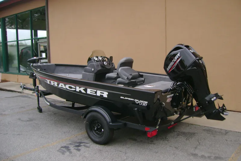 Slide: The Image of 2026 Tracker Super Guide V-16 SC fishing boat with Mercury outboard motor on trailer. - 5