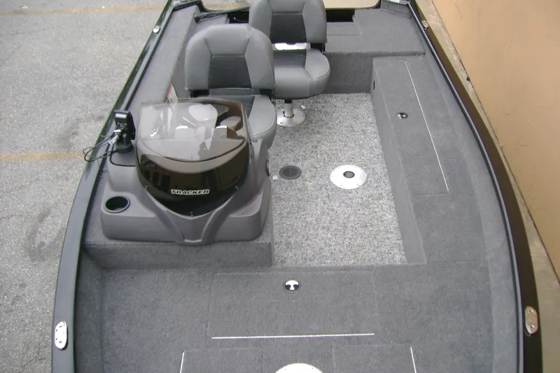 Slide: The Image of 2026 Tracker Super Guide V-16 SC boat interior with dual seats and carpeted flooring. - 11