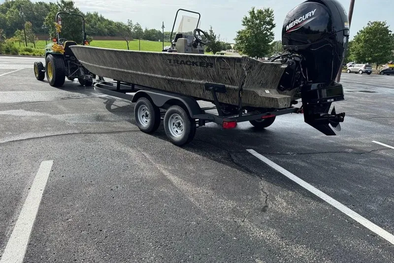 Slide: The Image of 2026 Tracker Grizzly 2072 CC boat on trailer in parking lot. - 6