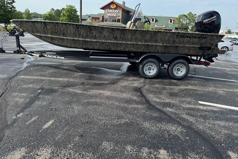 Slide: The Image of 2026 Tracker Grizzly 2072 CC boat on trailer in parking lot. - 7