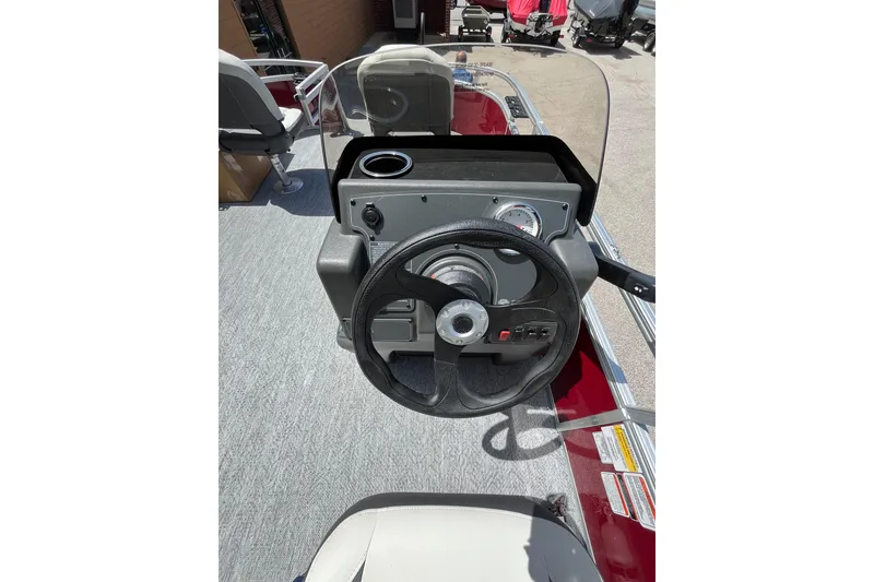 Slide: The Image of Steering console of 2026 Sun Tracker Bass Buggy 16 XL Select pontoon boat. - 5