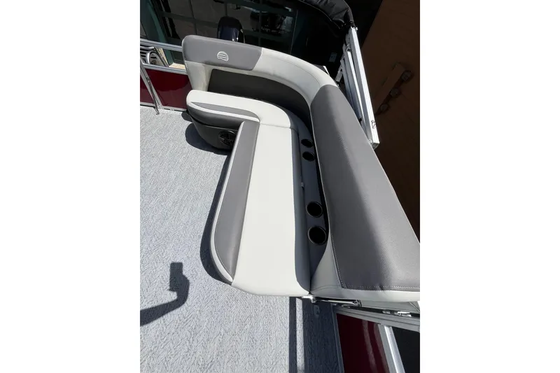 Slide: The Image of 2026 Sun Tracker Bass Buggy 16 XL Select boat seating with cup holders. - 2