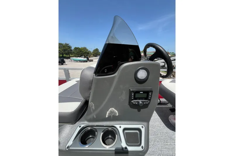 Slide: The Image of 2026 Sun Tracker Bass Buggy 16 XL Select dashboard with steering wheel and controls. - 6