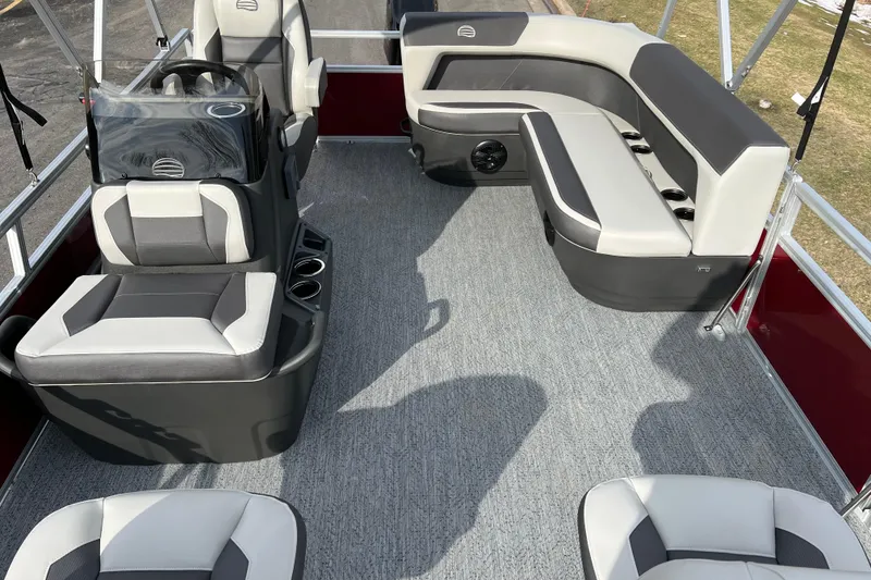 Slide: The Image of 2026 Sun Tracker Bass Buggy 16 XL Select pontoon boat interior with gray seating and carpet. - 3