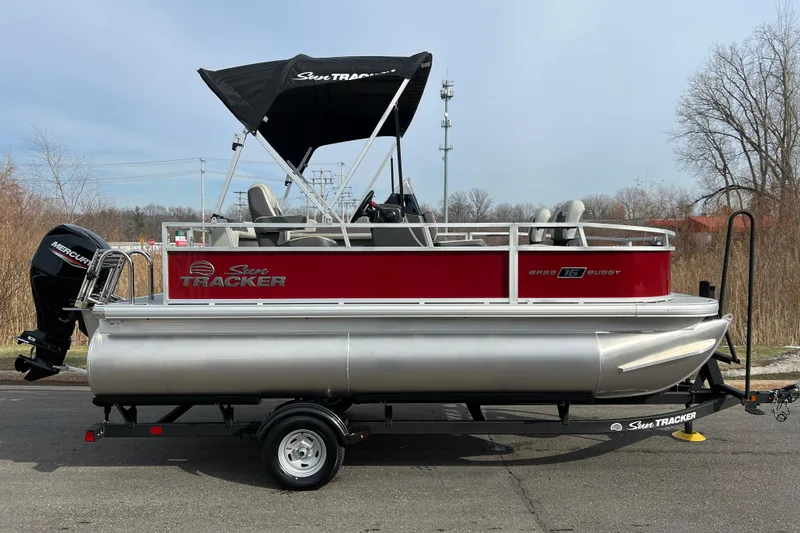 The Image of 2026 Sun Tracker Bass Buggy 16 XL Select pontoon boat with Mercury engine on trailer. - 0