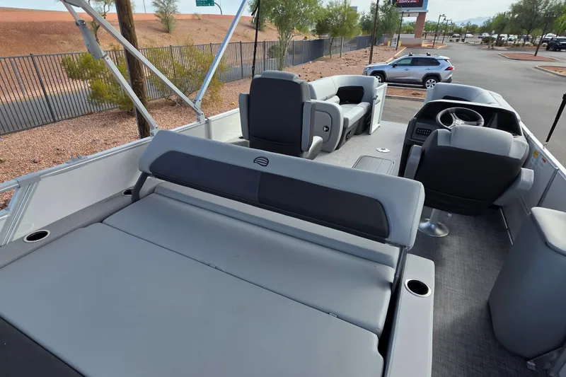Slide: The Image of 2026 Sun Tracker Party Barge 22 RF XP3 interior with seating and steering console. - 4