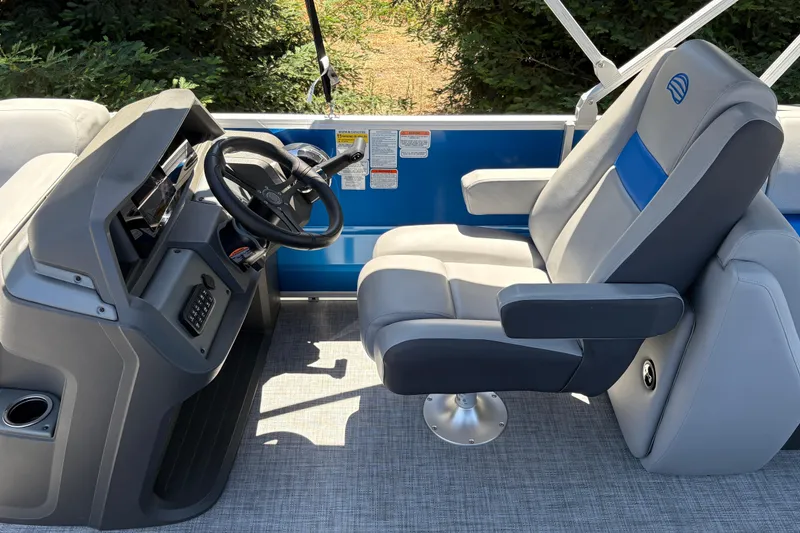 Slide: The Image of Captain's chair and helm of 2026 Sun Tracker Party Barge 22 XP3 pontoon boat. - 38