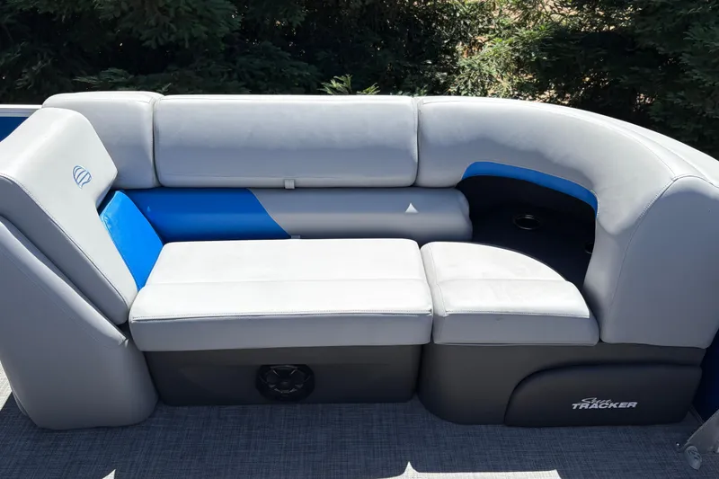 Slide: The Image of 2026 Sun Tracker Party Barge 22 XP3 seating with gray and blue upholstery. - 33