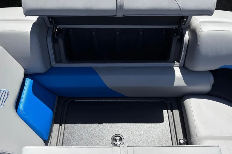 Slide: The Image of Open storage compartment on 2026 Sun Tracker Party Barge 22 XP3 boat seat. - 30