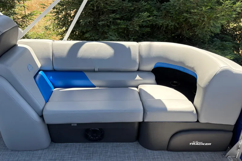 Slide: The Image of 2026 Sun Tracker Party Barge 22 XP3, featuring luxurious gray seating with blue accents. - 36