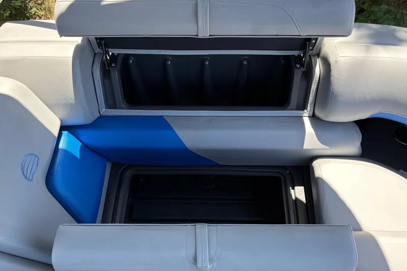 Slide: The Image of 2026 Sun Tracker Party Barge 22 XP3 seating with storage compartments open. - 37