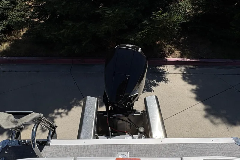 Slide: The Image of Top view of a 2026 Sun Tracker Party Barge 22 XP3 outboard motor. - 12