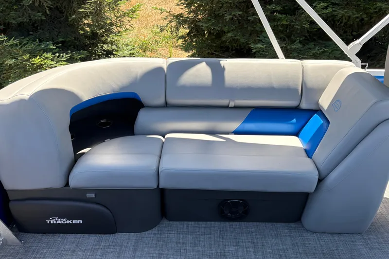 Slide: The Image of 2026 Sun Tracker Party Barge 22 XP3, featuring luxurious gray seating with blue accents. - 24