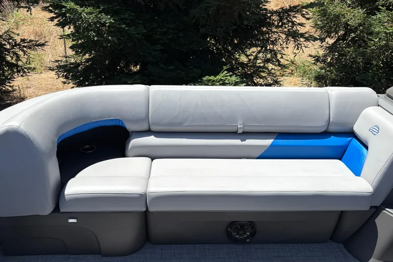 Slide: The Image of 2026 Sun Tracker Party Barge 22 XP3 seating with gray and blue upholstery. - 43