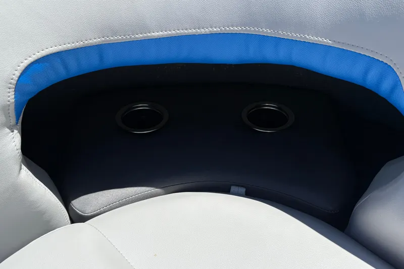 Slide: The Image of Cup holders on Sun Tracker Party Barge 22 XP3, 2026 model, with blue and gray seating. - 40