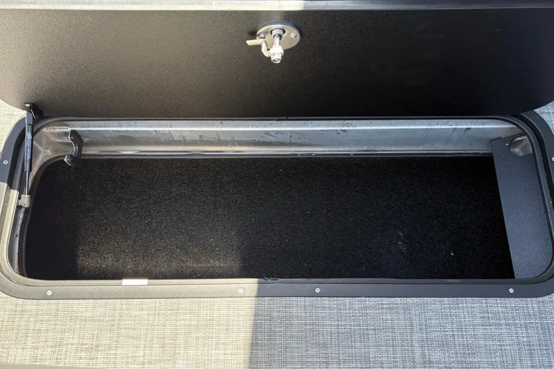 Slide: The Image of Open storage compartment on 2026 Sun Tracker Party Barge 22 XP3 boat. - 32