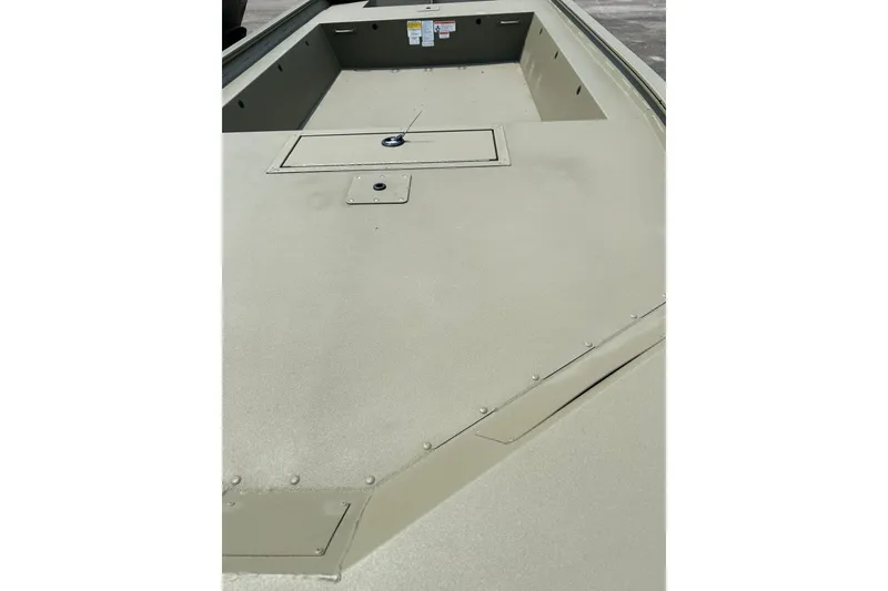 Slide: The Image of 2026 Tracker Grizzly 1754 Utility boat interior, showcasing spacious deck and storage compartments. - 4