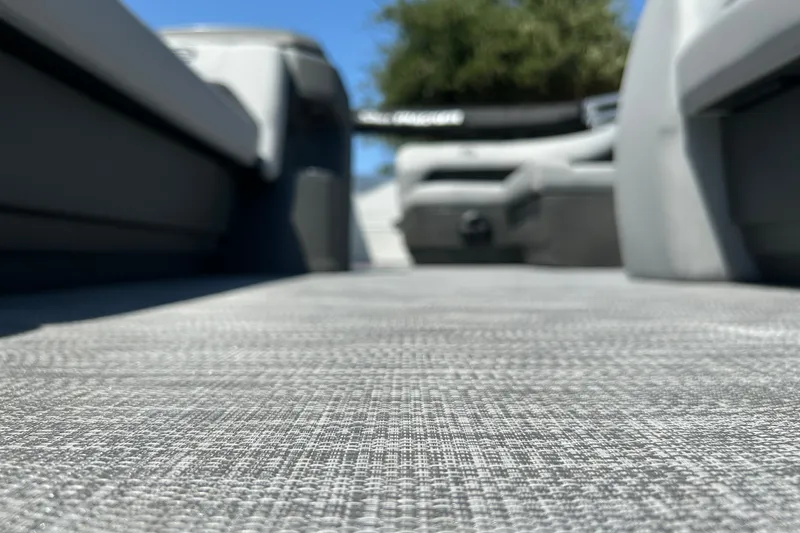 Slide: The Image of Interior view of 2026 Sun Tracker Party Barge 18 DLX, showcasing textured flooring. - 23