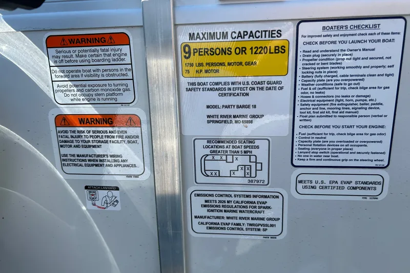 Slide: The Image of 2026 Sun Tracker Party Barge 18 DLX capacity and safety warnings on boat panel. - 20