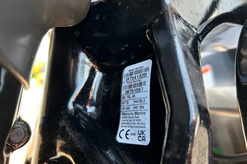 Slide: The Image of Close-up of a Mercury Marine engine label on a 2026 Sun Tracker Party Barge 18 DLX. - 95