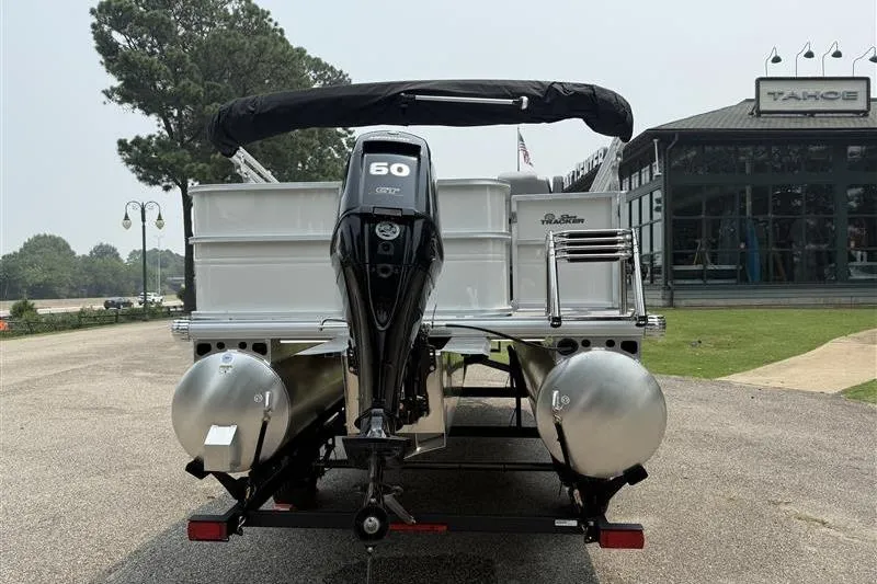 Slide: The Image of 2026 Sun Tracker Party Barge 18 DLX pontoon boat with 60 HP engine, rear view. - 3