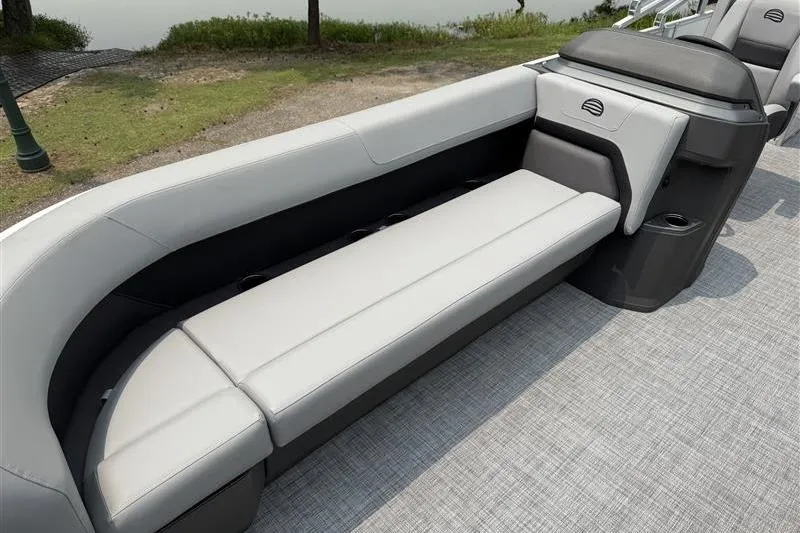 Slide: The Image of 2026 Sun Tracker Party Barge 18 DLX interior seating with gray upholstery and modern design. - 14