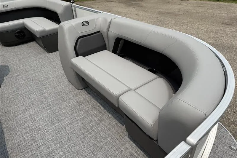 Slide: The Image of 2026 Sun Tracker Party Barge 18 DLX interior with gray seating and flooring. - 13