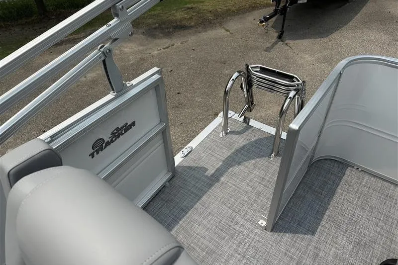 Slide: The Image of 2026 Sun Tracker Party Barge 18 DLX pontoon boat with ladder and railing detail. - 17