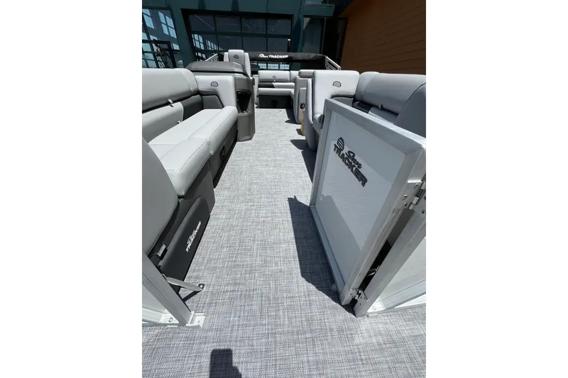 Slide: The Image of 2026 Sun Tracker Party Barge 20 DLX interior with spacious seating and modern design. - 6