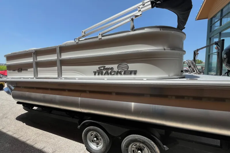 Slide: The Image of 2026 Sun Tracker Party Barge 20 DLX pontoon boat on trailer, side view. - 8