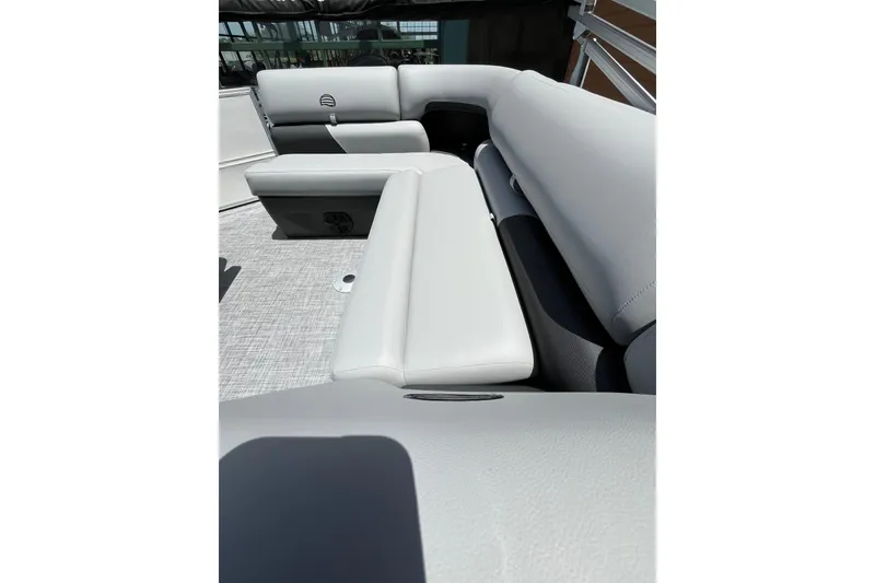 Slide: The Image of 2026 Sun Tracker Party Barge 20 DLX interior seating with light gray upholstery. - 3